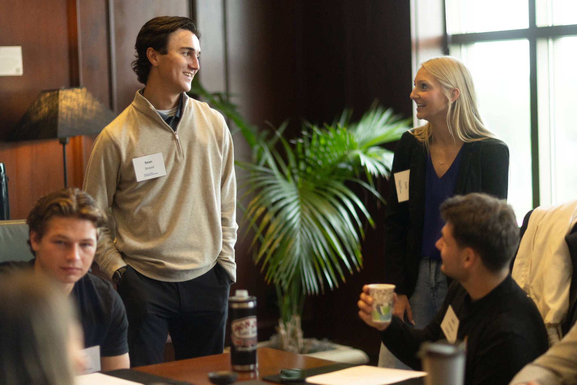 A group of Cook Leadership Academy fellows chat during orientation.